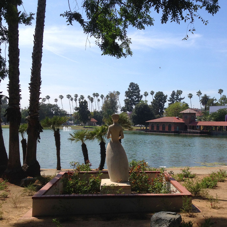Statue from behind overlooking lake in Lincoln Heights